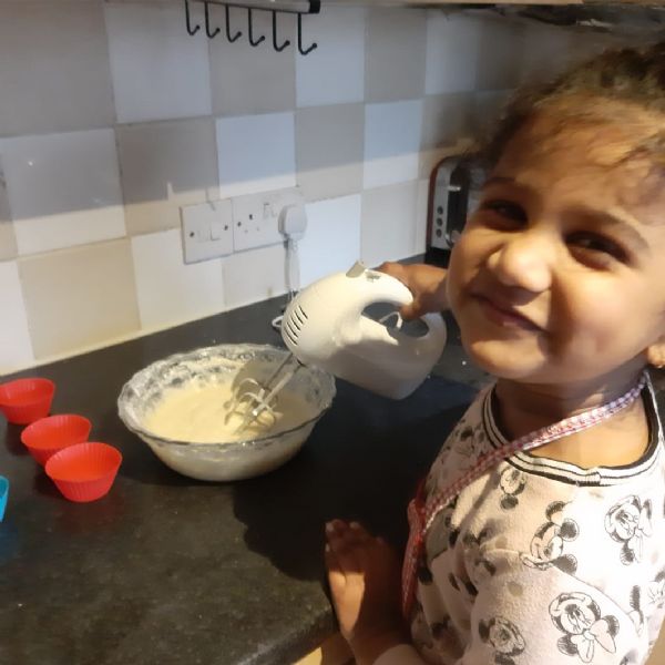 Zoey making cakes