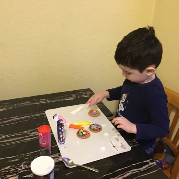 Samuel decorating biscuits